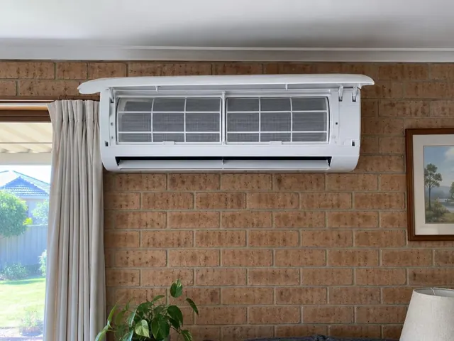 Clean split system indoor unit on a brick wall with open front panel and visible filters in Elizabeth Park